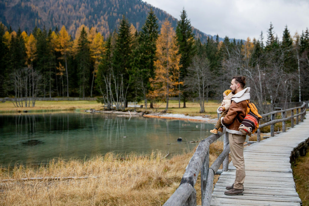 man in jacket overlooking fall landscape